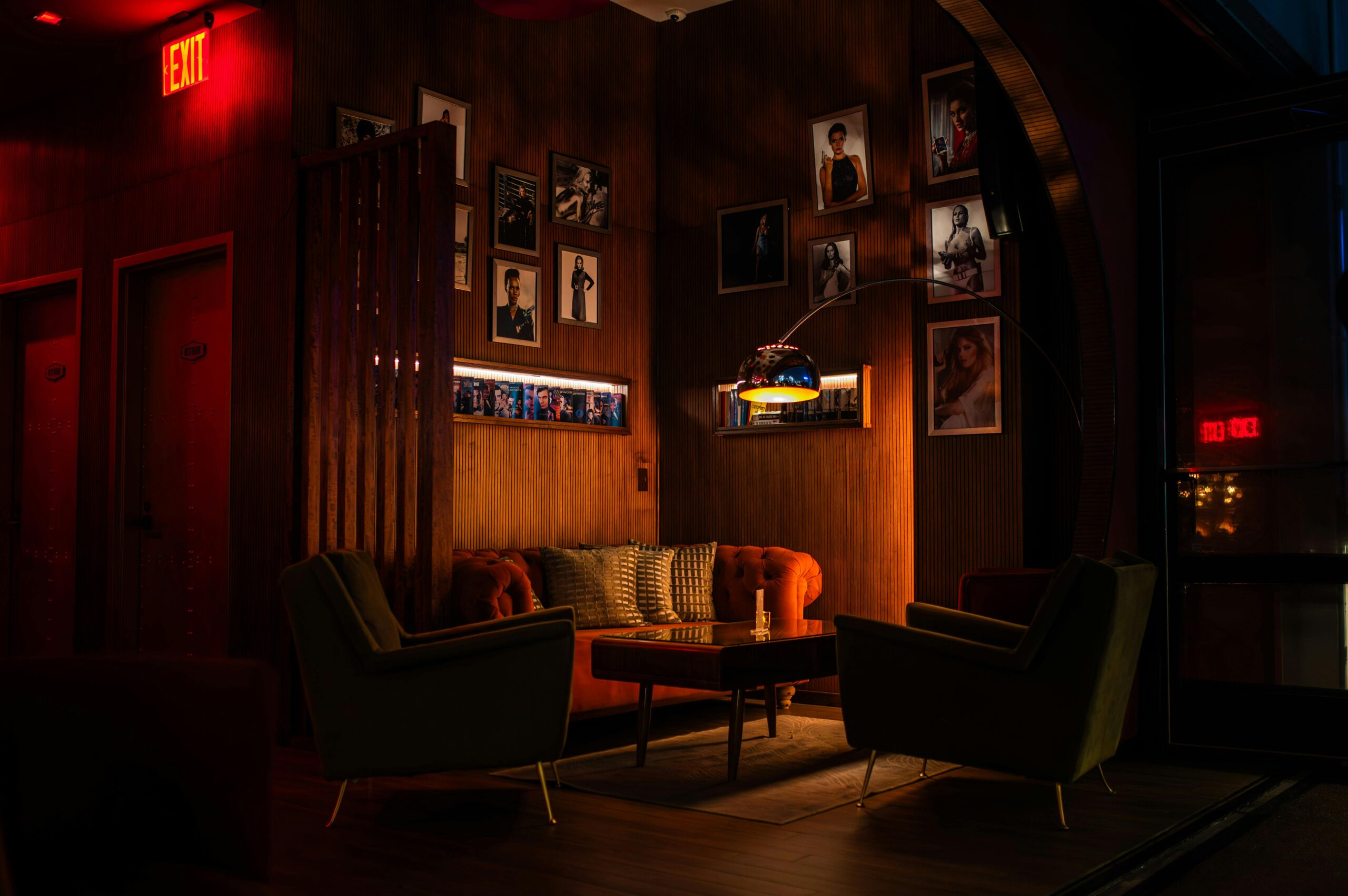Warm, dimly lit lounge interior with plush seating and artistic decor in New York.